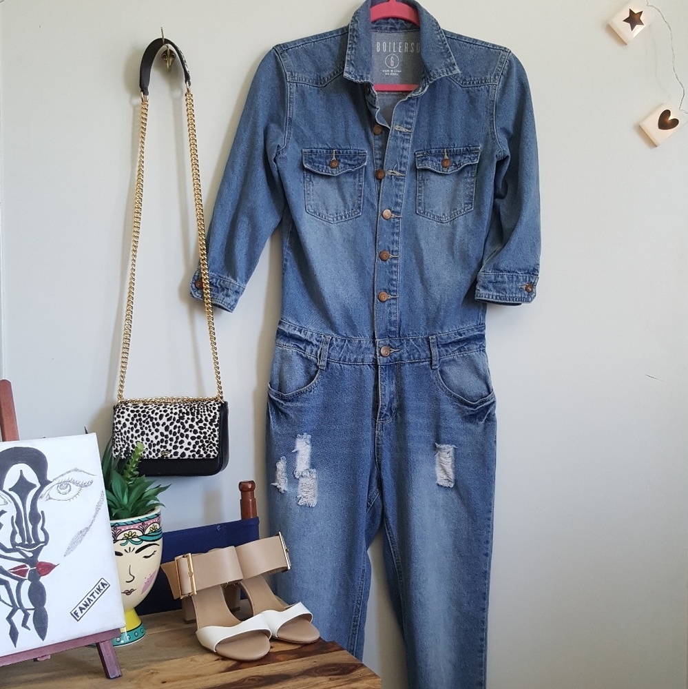 A blue distress denim boilersuit size 6